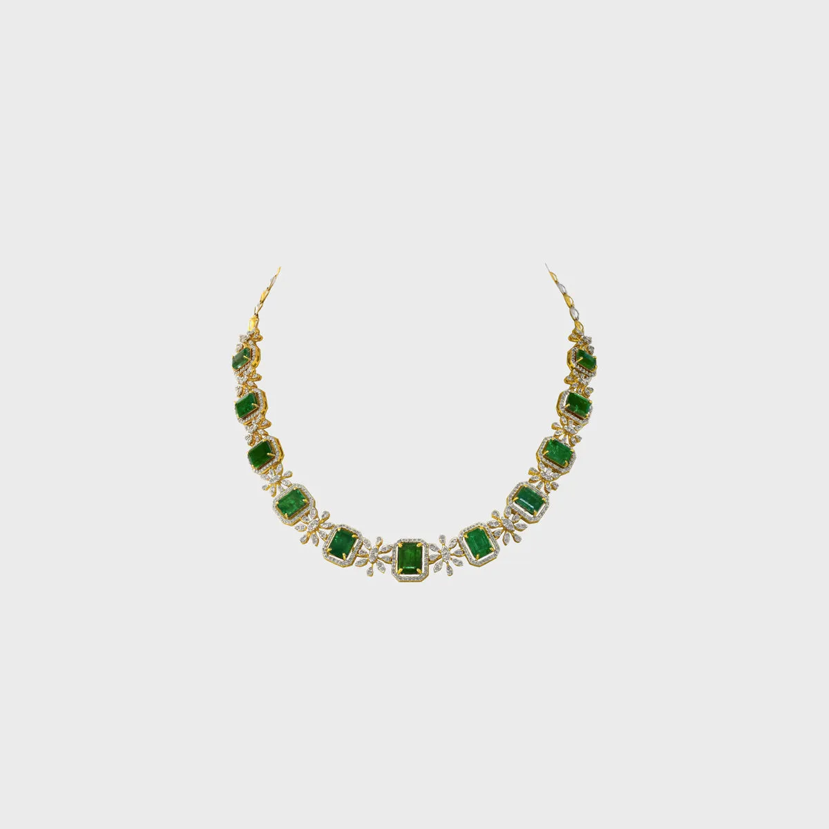 The necklace showcases a series of vibrant octagon-shaped emeralds - (PGDNE0128)