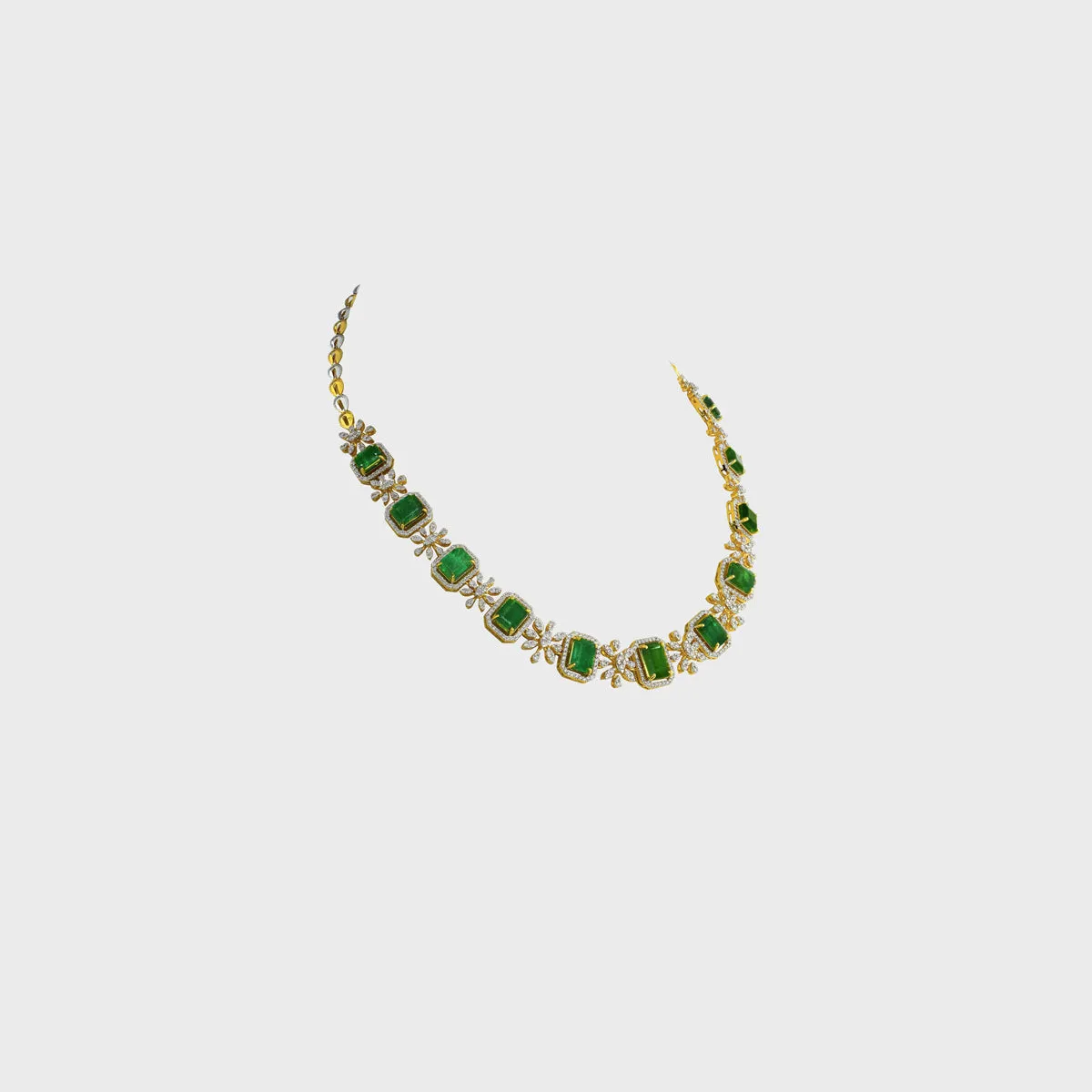 The necklace showcases a series of vibrant octagon-shaped emeralds - (PGDNE0128)